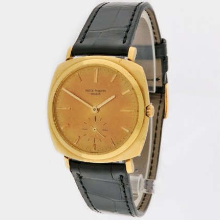 Patek Philippe Mens Vintage Calatrava Automatic Cushion Wristwatch in 18K Yellow Gold. Model Reference 3525J. Wonderful original dial with patina. Includes Archive Paper.