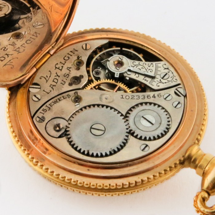LADY ELGIN 14K 27mm Open Face Ladies High Relief Extra Fancy Floral Pendant Watch Yellow Gold Grade 255 Size 10/0. One of the fanciest Pendant Watches.