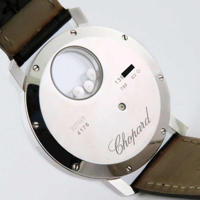 Chopard Ladies Happy Diamonds 'Happy Sun' 18K White Gold 3ct Factory Diamonds & Floating Rubies Ladies Wristwatch Ref.207469 / 207470 40mm. MSRP $56,600.