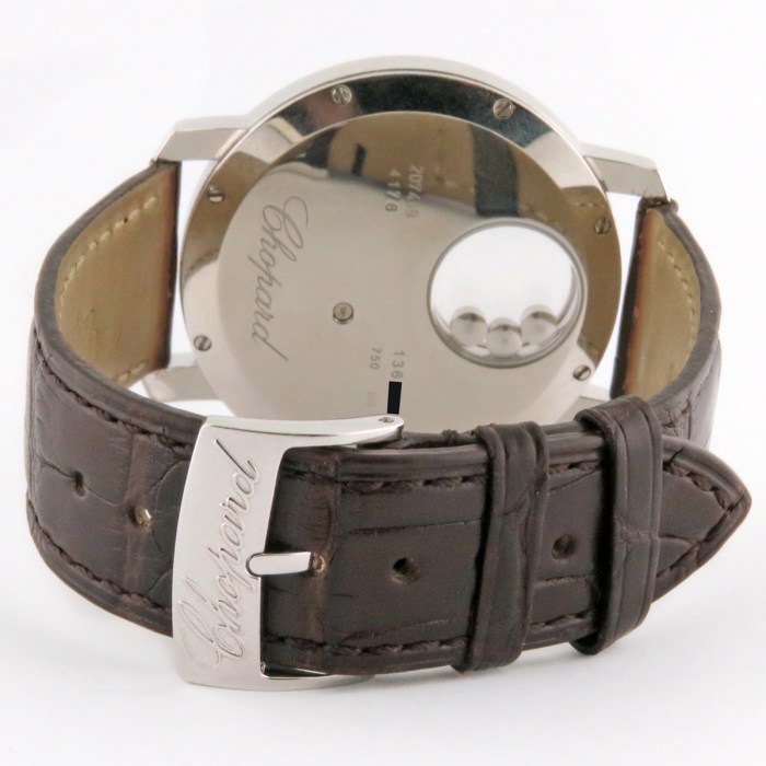 Chopard Ladies Happy Diamonds 'Happy Sun' 18K White Gold 3ct Factory Diamonds & Floating Rubies Ladies Wristwatch Ref.207469 / 207470 40mm. MSRP $56,600.
