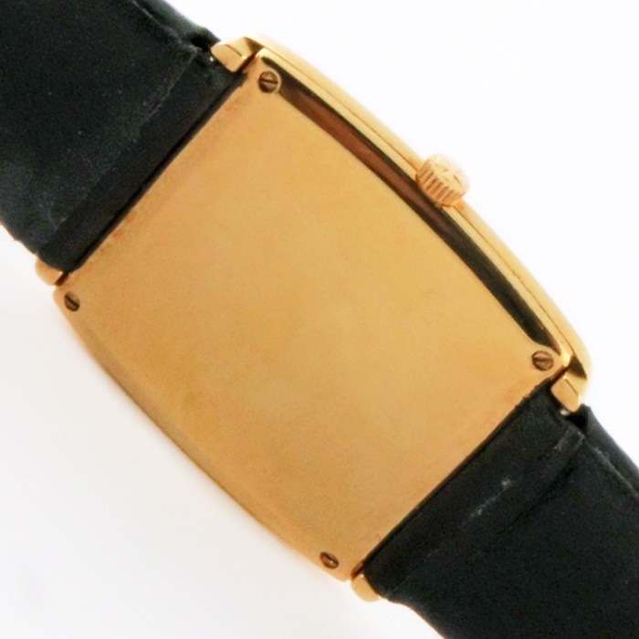 Vacheron Constantin Vintage 18K Solid Yellow Gold Rectanglar Wristwatch with Curved Sides and Linen Dial. Reference 6990, Caliber 1003 UltraThin Movt. 26x31mm