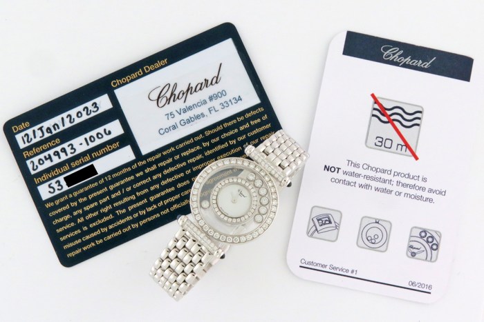 Chopard Ladies Happy Diamonds with 7 Floating Diamonds and Fully Diamond Set Bezels. 18K White Gold Bracelet Ladies Wristwatch Ref.204993 25mm. MSRP $24,370