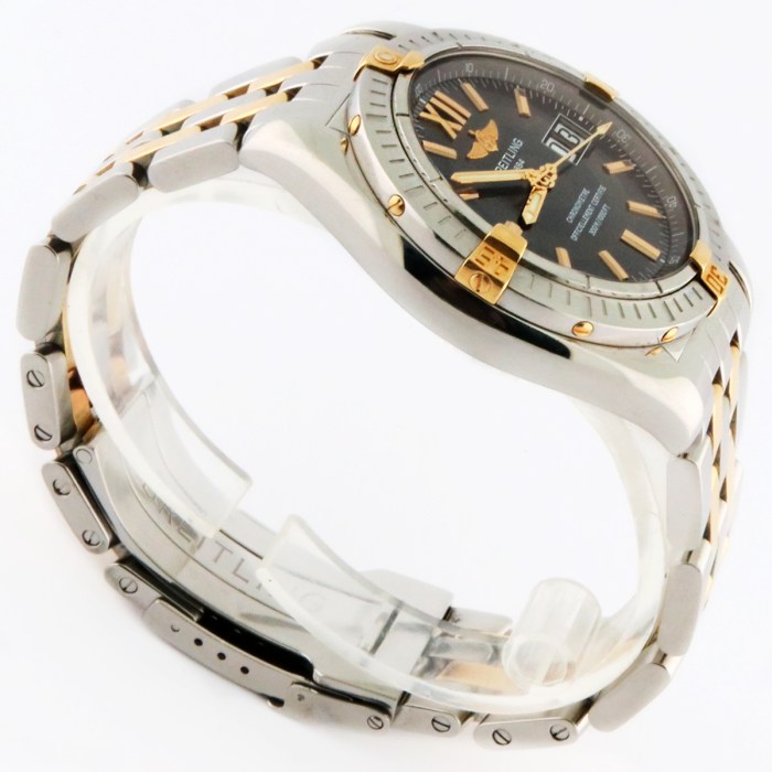 Breitling Cockpit Grand Date Automatic Wristwatch with Engine-Turned Grey-Black Dial in 18K Gold & Stainless Steel Bracelet . Model reference is B4935011/B780