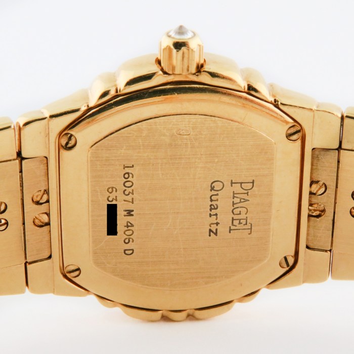 Top luxury watch Piaget Tanagra Ladies 18K Yellow Gold Watch with full PAVE factory diamond & ruby dial. Ref.16037 M 406 D. 25mm MSRP $68,780