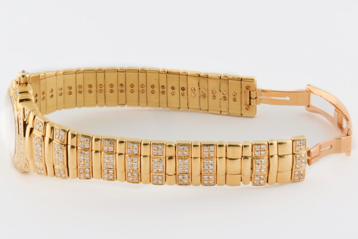 Top luxury watch Piaget Tanagra Ladies 18K Yellow Gold Watch with full PAVE factory diamond & ruby dial. Ref.16037 M 406 D. 25mm MSRP $68,780