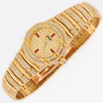 Top luxury watch Piaget Tanagra Ladies 18K Yellow Gold Watch with full PAVE factory diamond & ruby dial. Ref.16037 M 406 D. 25mm MSRP $68,780
