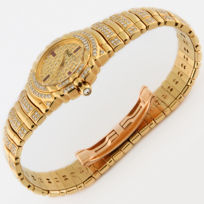 Top luxury watch Piaget Tanagra Ladies 18K Yellow Gold Watch with full PAVE factory diamond & ruby dial. Ref.16037 M 406 D. 25mm MSRP $68,780