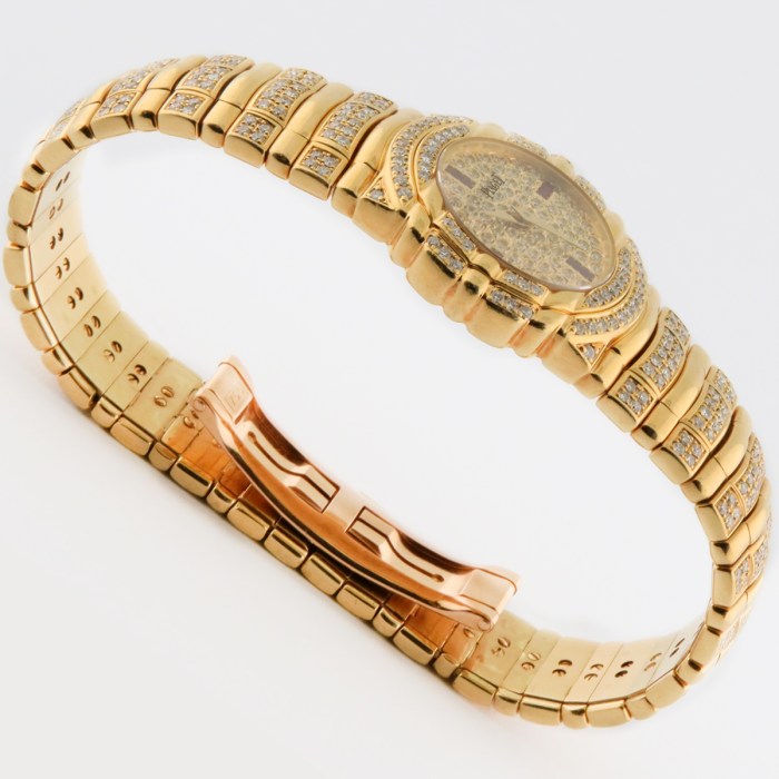 Top luxury watch Piaget Tanagra Ladies 18K Yellow Gold Watch with full PAVE factory diamond & ruby dial. Ref.16037 M 406 D. 25mm MSRP $68,780